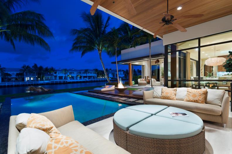 Modern Covered Patio Overlooking Pool and Nearby Waterway