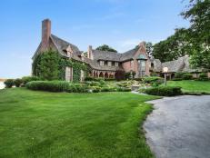 Tudor Manor With Lush Front Lawn and Landscaping
