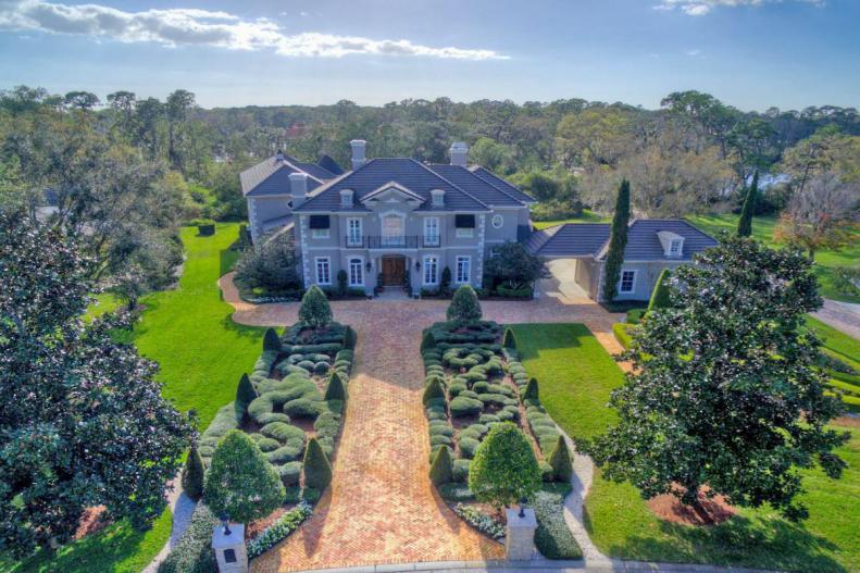 Traditional Home With Brick Pathways