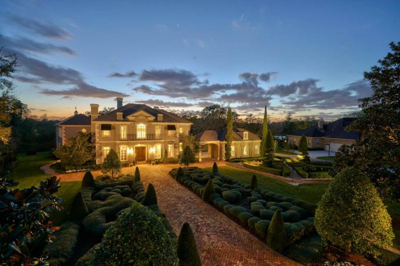 Traditional Home With Brick Pathways