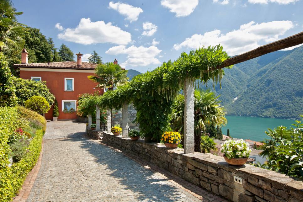 Mediterranean Home With Brick Walkway