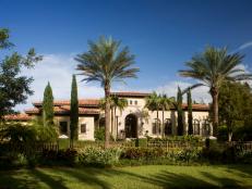 Mediterranean Home With Neutral Stucco Exterior and Spanish Tile Roof