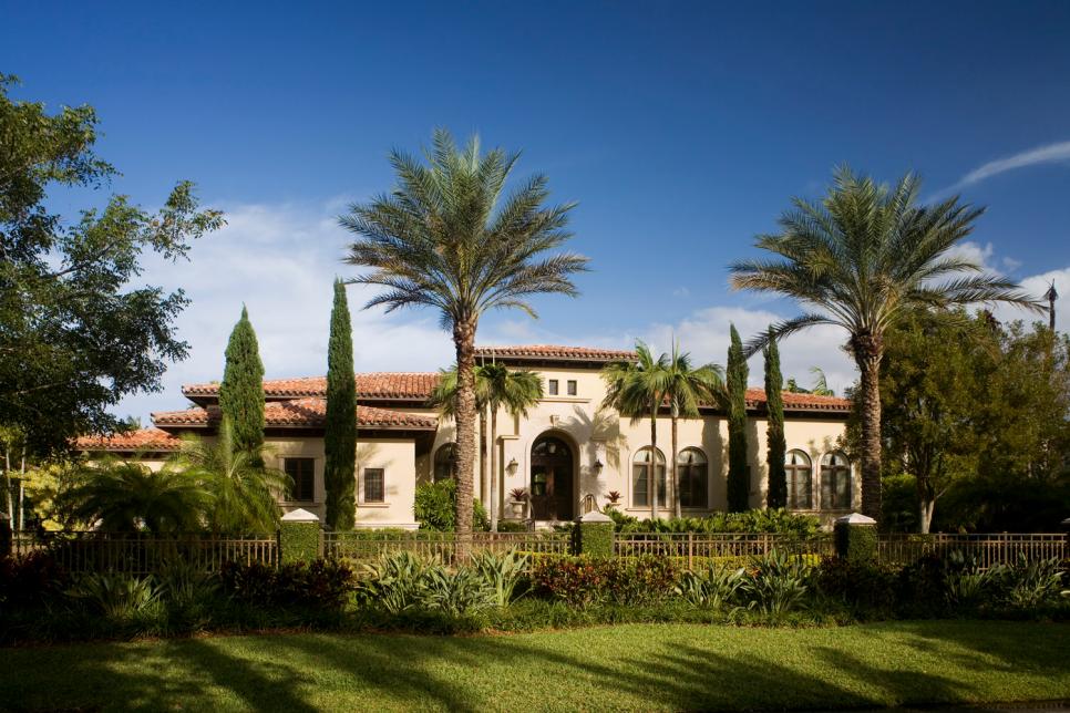 Home With Neutral Stucco Exterior and Spanish Tile Roof