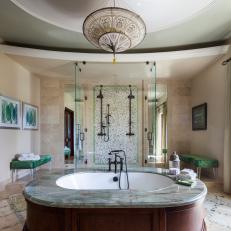 Luxurious Master Bathroom With Glass Walk-In Shower and Green Accents