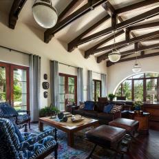 Traditional Living Room With Exposed Beam Ceiling and Blue Accents