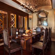 Mediterranean Wine Cellar With Brick Ceiling and Glass Front Cabinets