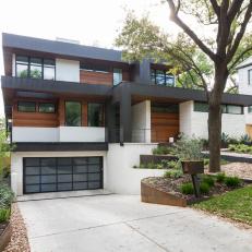 Contemporary Home With Wood Panel and White Stone Exterior 