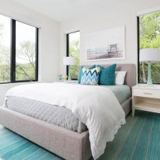 White and Turquoise Guest Bedroom With Black Metal Framed Windows