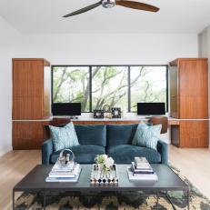 Light and Bright Home Office With Teal Velvet Sofa and Built-In Desk