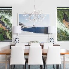 Light and Bright Dining Room With White Upholstered Chairs