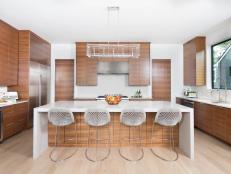 White Kitchen With Walnut Cabinets and White Stone Countertops