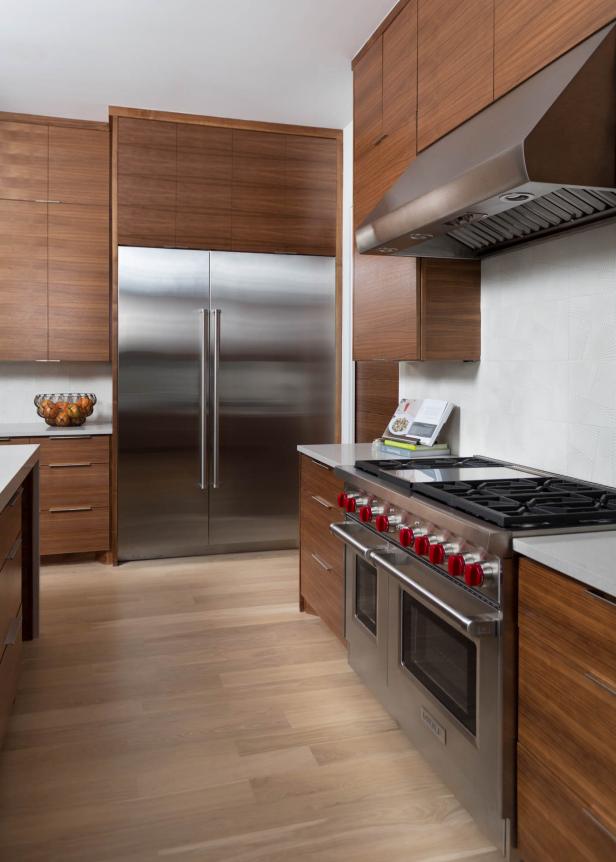 White Kitchen With Brown Wood Cabinets and Stainless Steel Appliances