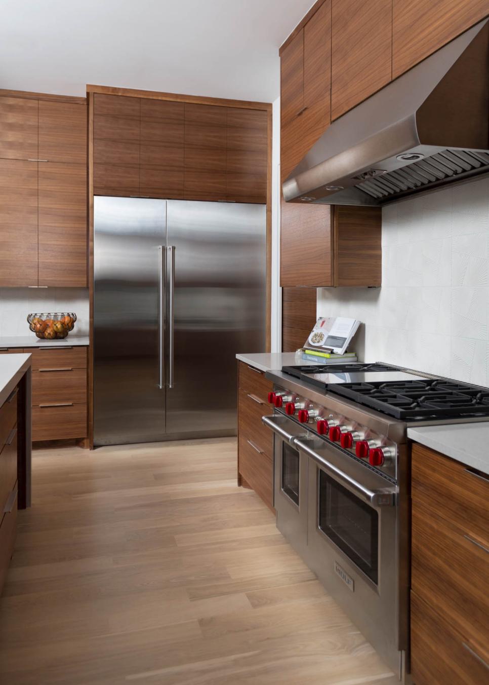 Modern Kitchen With Flat Front Walnut Cabinets and Stainless Steel ...