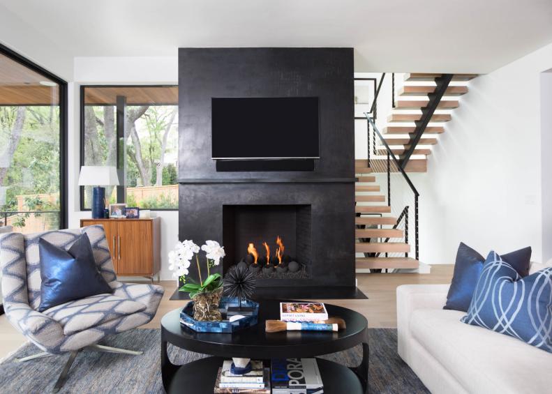 Blue and White Living Room With Black Coffee Table and Fireplace