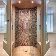 Glass Enclosed Master Bathroom Shower Stall With Brown Mosaic Tiles