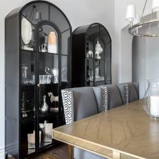 Transitional Dining Room With a Pair of Black Metal Cabinets