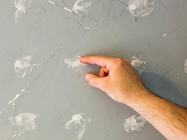 Inspect the walls of the room before applying paint. Repairing holes and knocking down wall texture will make each coat go on smoother and the end product will look better.