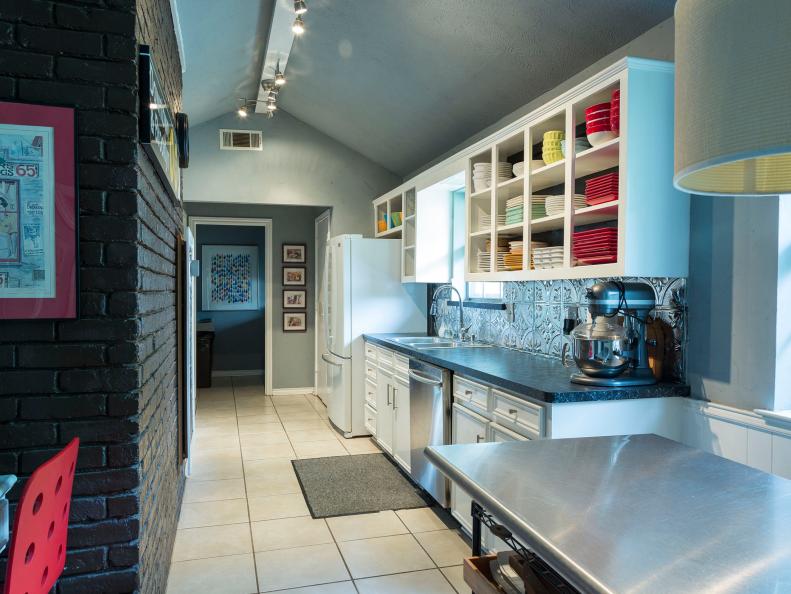 The dark colors in this modern kitchen makes the space feel smaller than it actually is. Luckily, a fresh coat of paint will change all of that.