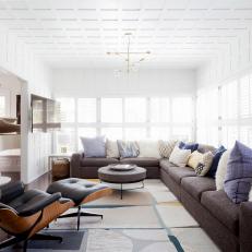 Contemporary Bonus Room With Leather Chair and Gray Sectional