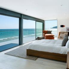 White, Modern Oceanside Bedroom with Wood Furnishings