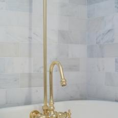 Cast-Iron Bathtub With Gold Fixtures