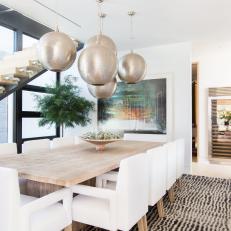 Contemporary Dining Room With White Chairs
