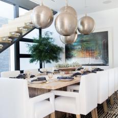 Contemporary Dining Room With Silver Globe Lights