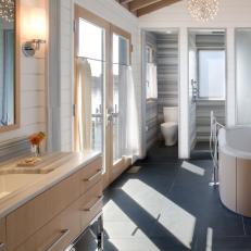 Modern Guest Bath With Light Wood Accents
