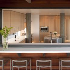 Contemporary Kitchen Pairs Chrome Fixtures, Wood Cabinetry