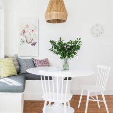 White Breakfast Nook With Graphic Pillows
