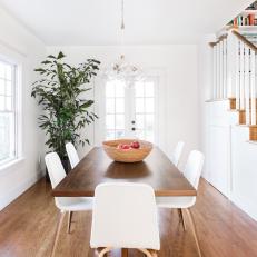 White Transitional Dining Room With Houseplant