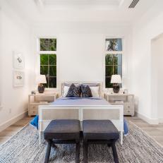 White Bedroom With Two Gray Stools