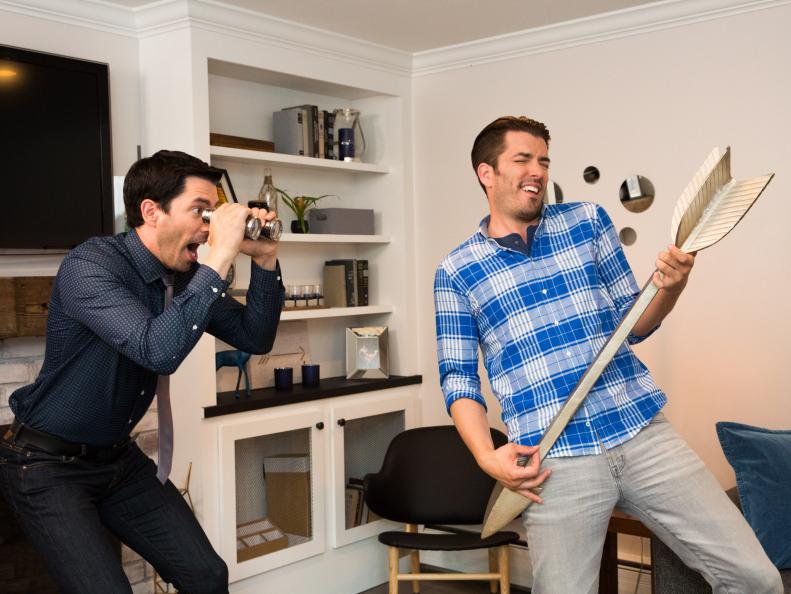 Hosts Jonathan (R) and Drew (L) Scott poses for a portrait in the living room of Marc Littman and Ashleigh Wolkoff's newly-remodeled home in Chappaqua, New York, as seen on Property Brothers. (Portrait)
