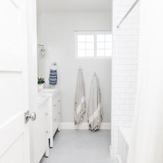 Classic White Bathroom With Subway Tile Shower