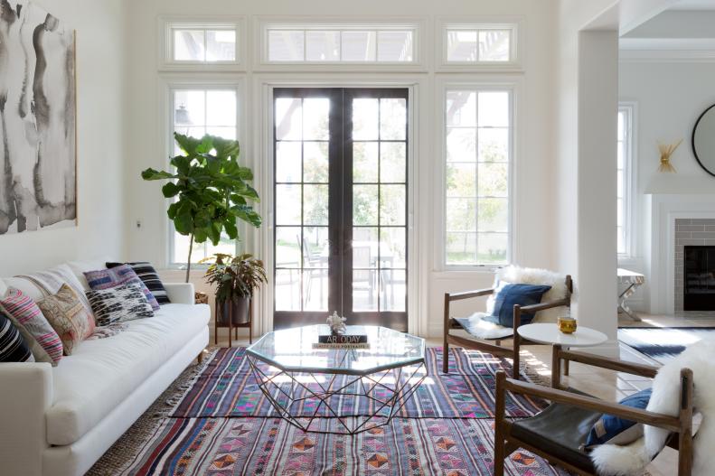 Eclectic Living Room With Layered Rugs