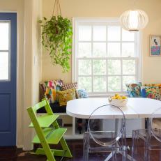 Eclectic Eat-In Kitchen With Green High Chair