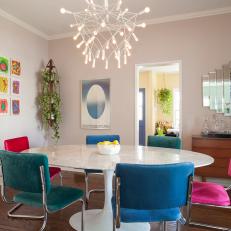 Eclectic Dining Room With Multicolored Chairs