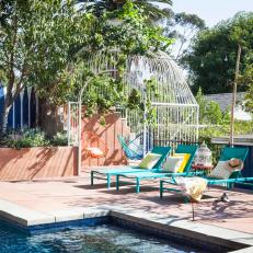 Eclectic Poolside Patio With Blue Chairs