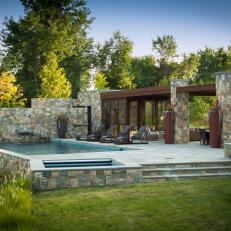 Stone Pool House With Pool and Waterfall