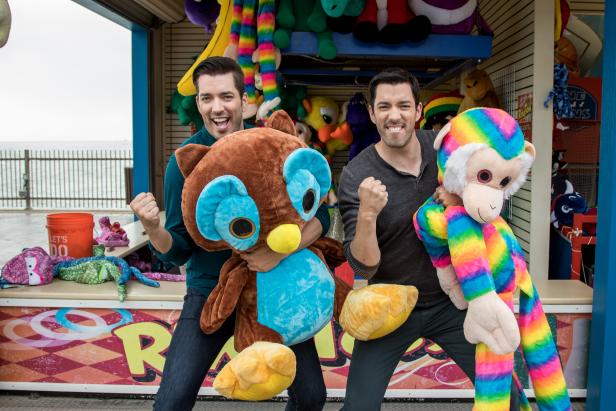 Jonathon and Drew Scott explore the midway at the historic Pleasure Pier in Galveston, TX as seen on Brother vs. Brother. 