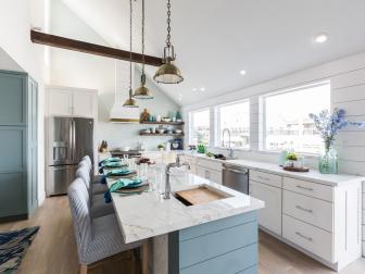 Large windows adjacent to the kitchen provide a light and airy feel in Drew Scott's design, as seen on Brother vs. Brother. (After #2)