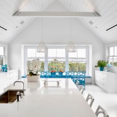 White Tropical Eat-In Kitchen With Blue Chairs