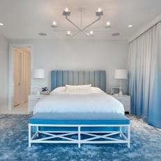 Contemporary Blue and White Bedroom With Bench