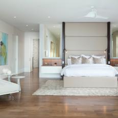 Contemporary Master Bedroom With White Furnishings