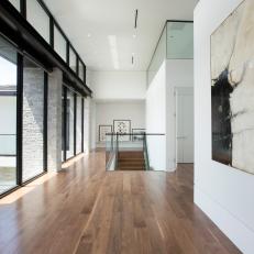 Contemporary Upstairs Hallway With Hardwood Flooring