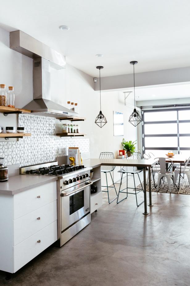 Concrete Floor And Steel And Glass Garage Door In Communal Kitchen