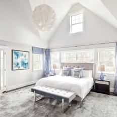 Master Bedroom With Blue Curtains and White Custard Pendant