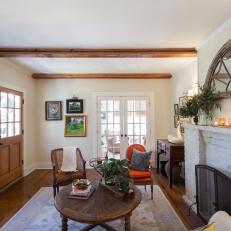 Brown French Country Living Room with Pine Ceiling Beams 