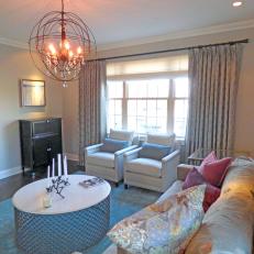 Farmhouse Eclectic Sitting Room With Drapes and Whimsical Lighting