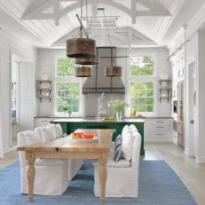 White Cottage Open Kitchen and Dining Room With Ladder